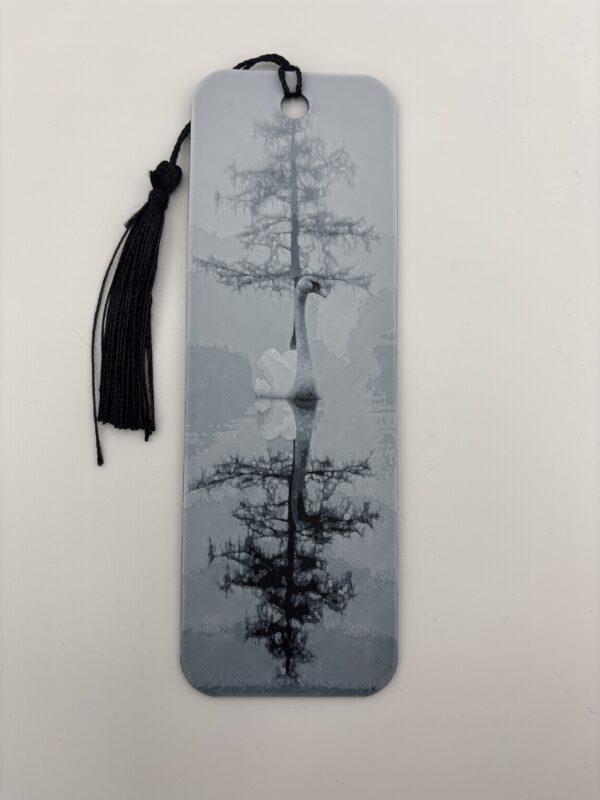 3D printed monochrome reflected tree bookmark with decorative tassel on white background