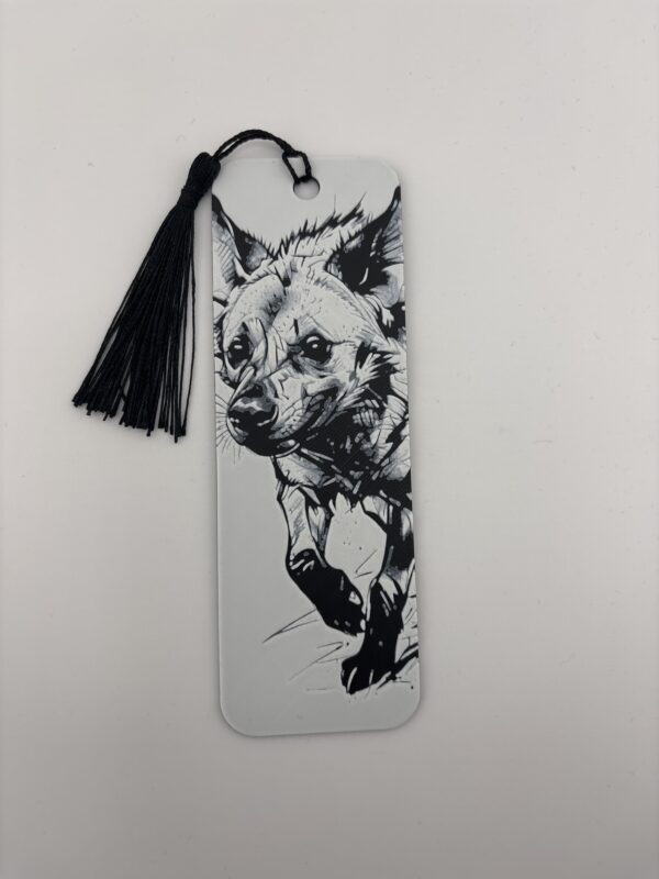 3D printed monochrome hyena bookmark with tassel on white background 3D printed monochrome hyena bookmark with tassel on white background