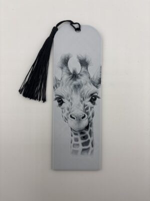 3D printed monochrome giraffe bookmark with black tassel on white background