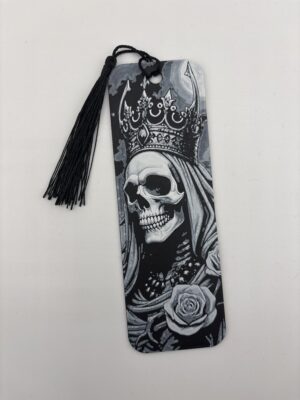 3D printed monochrome skull bookmark with tassel on white background