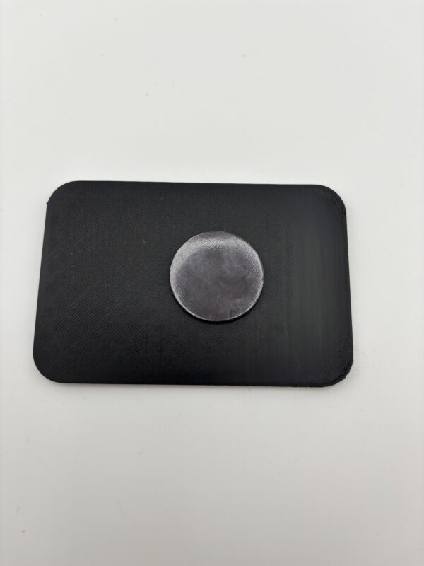 Back of 3D printed fridge magnet with strong round magnet