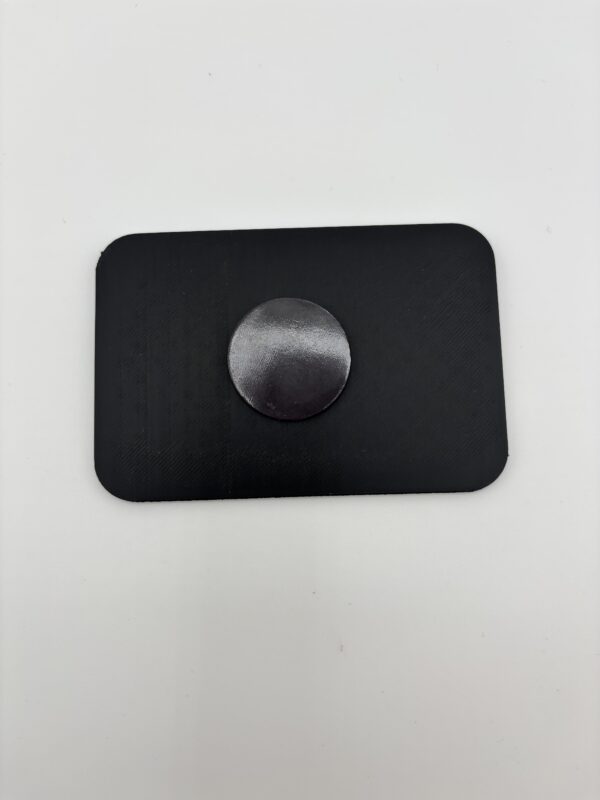 Back of 3D printed fridge magnet showing strong round magnet backing