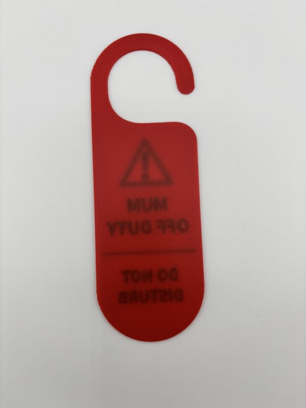 Back of red 3D printed mum off duty do not disturb door hanger showing reversed design