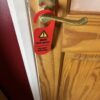 Mum off duty do not disturb door hanger hanging on a door handle